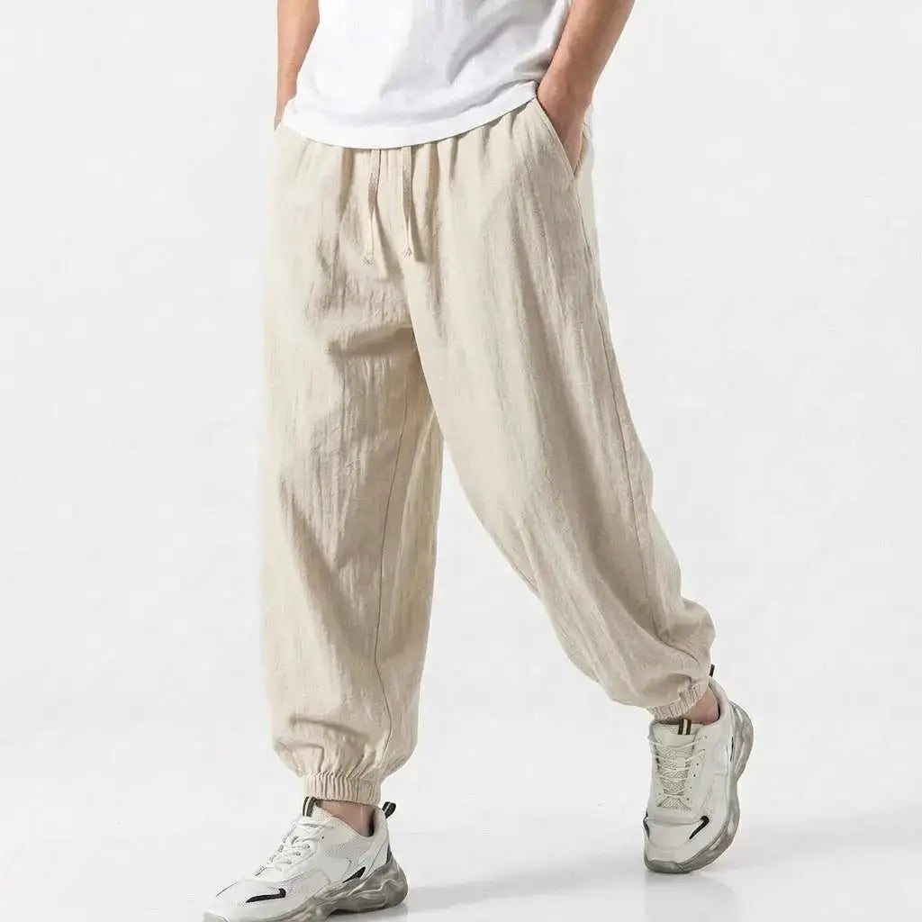 Green men's cotton linen harem trousers with drawstring, loose fit, casual streetwear style for gym and daily wear.
