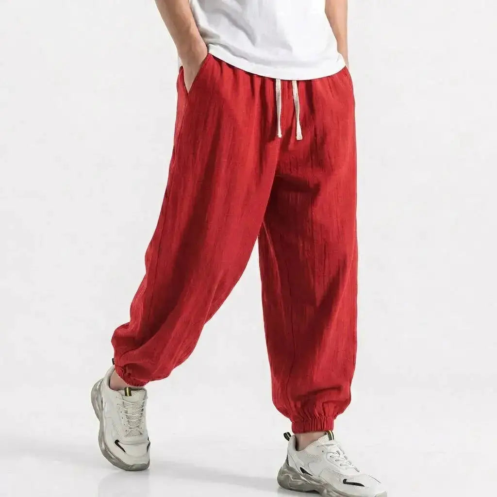Green men's cotton linen harem trousers with drawstring, loose fit, casual streetwear style for gym, daily wear, and work.