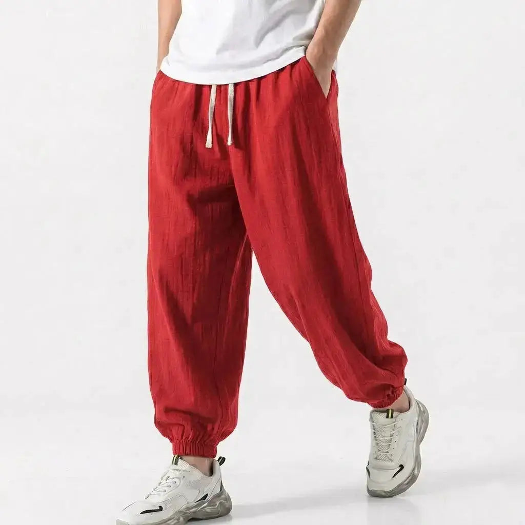 Green men's cotton linen harem trousers with drawstring, loose fit, baggy bottoms, casual streetwear style for gym and daily wear.