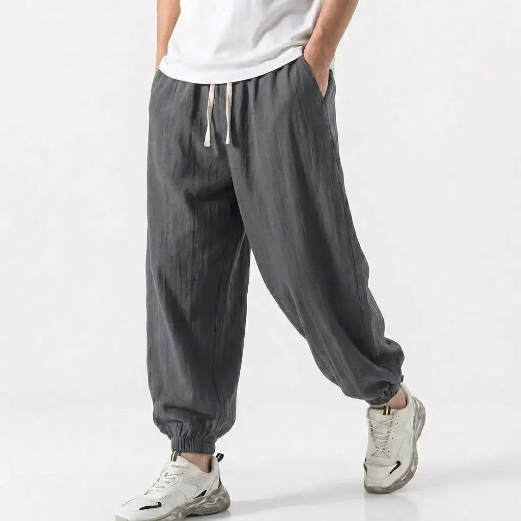 Green men's cotton linen harem trousers with drawstring, loose fit, casual streetwear style for gym and daily wear by SHOPEZRA L.L.C.