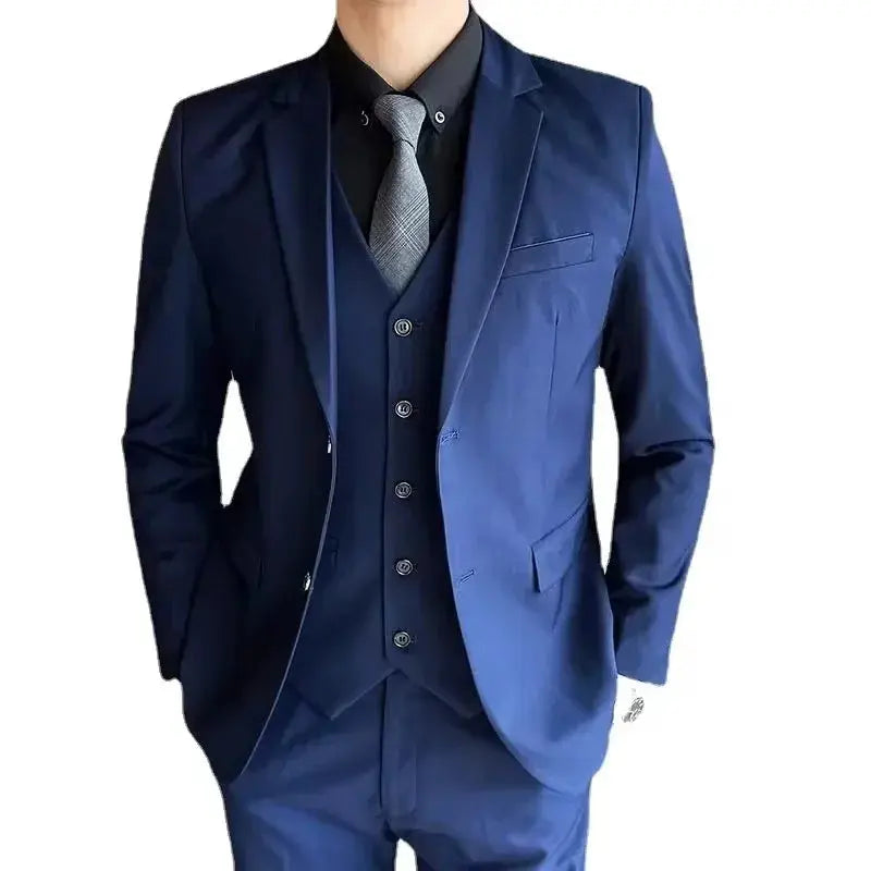 Men's grey British style wedding suit with blazer, vest, and pants, featuring two-button blazer, suitable for formal and outdoor occasions.