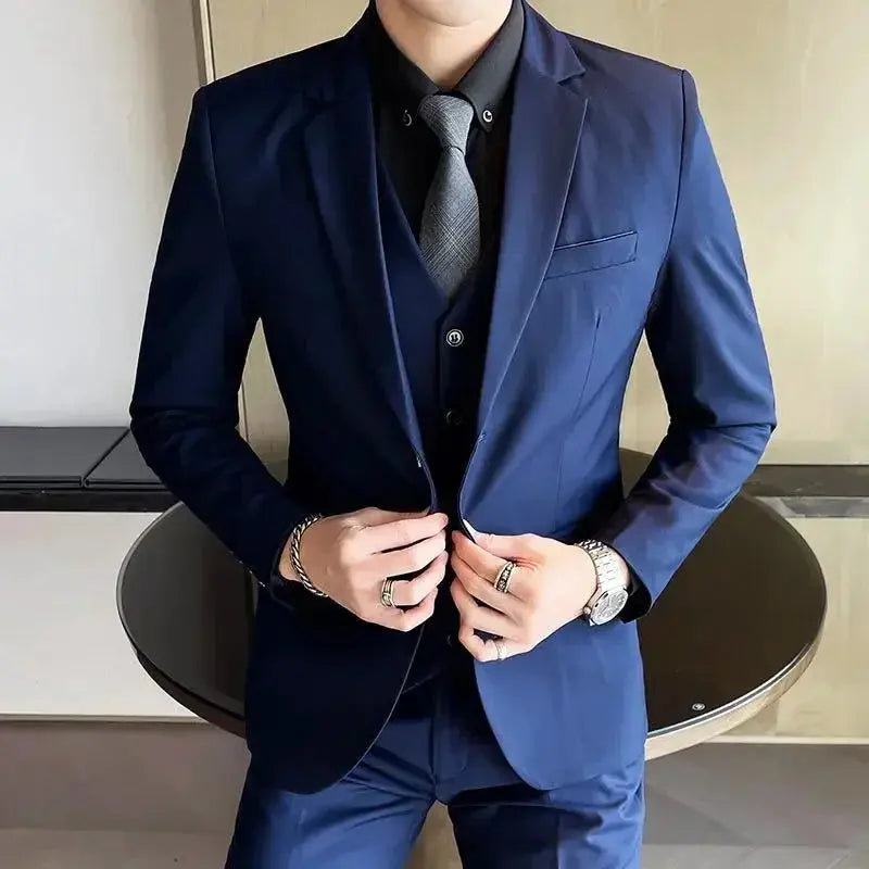 Men's grey British style wedding suit with blazer, vest, and pants, featuring two buttons, perfect for formal or outdoor occasions.