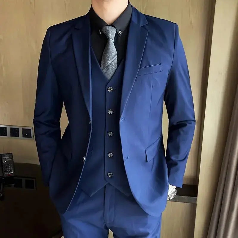 Men's grey British style wedding suit with blazer, vest, and pants featuring two-button design, suitable for formal and outdoor occasions.