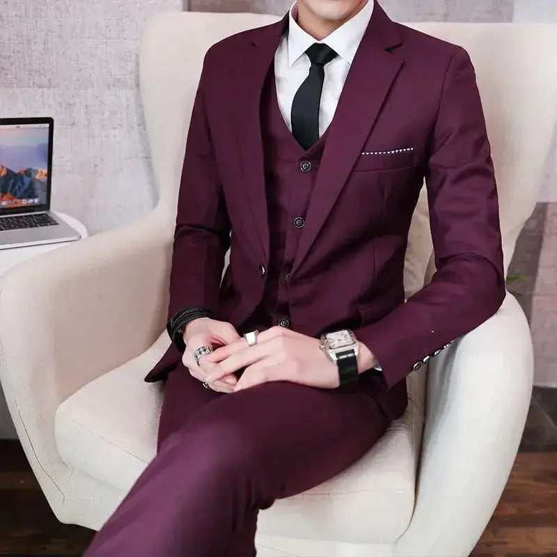Men's grey British-style wedding suit with blazer, vest, and pants, featuring two buttons for formal and casual outdoor occasions.