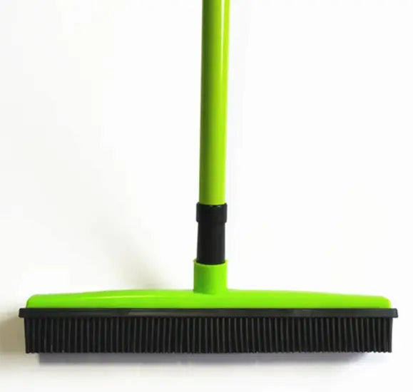 Pet hair removal broom for effective fur cleaning on carpets and floors.