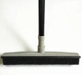 Pet hair removal broom for effective cleaning of carpets and floors, featuring a grey head and a durable handle.