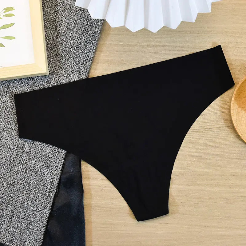 Cream white women's seamless cotton thong underwear from SHOPEZRA L.L.C., designed for sports and fitness with antibacterial ice silk fabric.