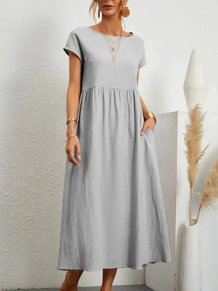 Women’s khaki cotton linen midi casual sundress with short sleeves, loose fit, A-line style, pockets, and oversized design.