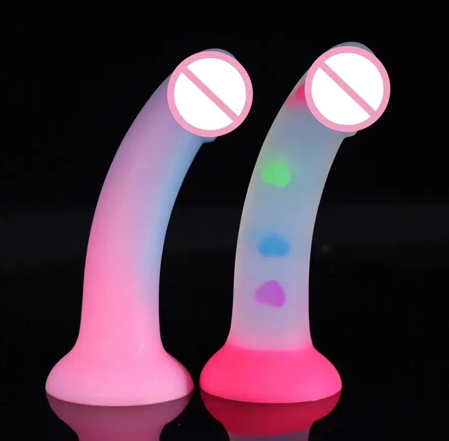 Soft luminous silicone dildo with realistic skin texture, suction cup base, designed for female and male pleasure.
