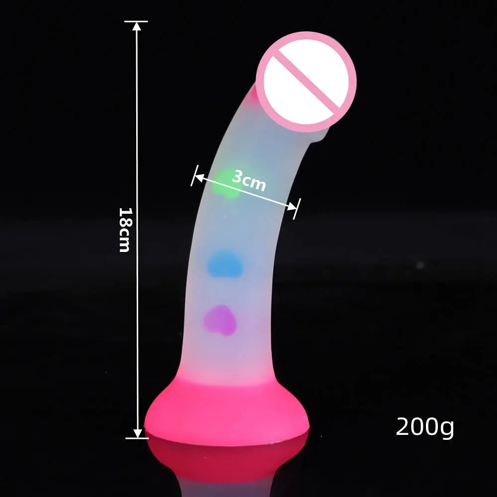 Luminous silicone female masturbator with realistic skin texture, suction cup base, designed for pleasure and comfort.