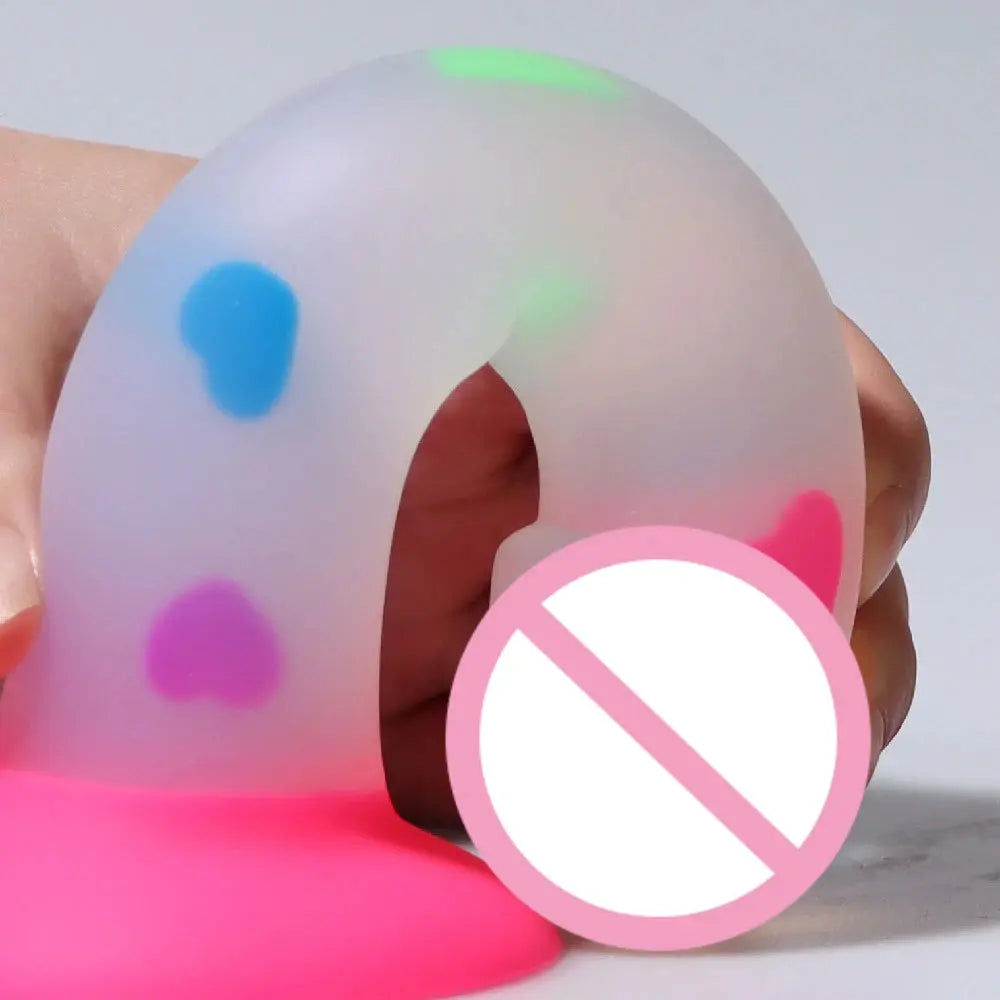 Cute soft luminous silicone dildo with realistic skin feeling, suction cup base, ideal for female and male masturbation.