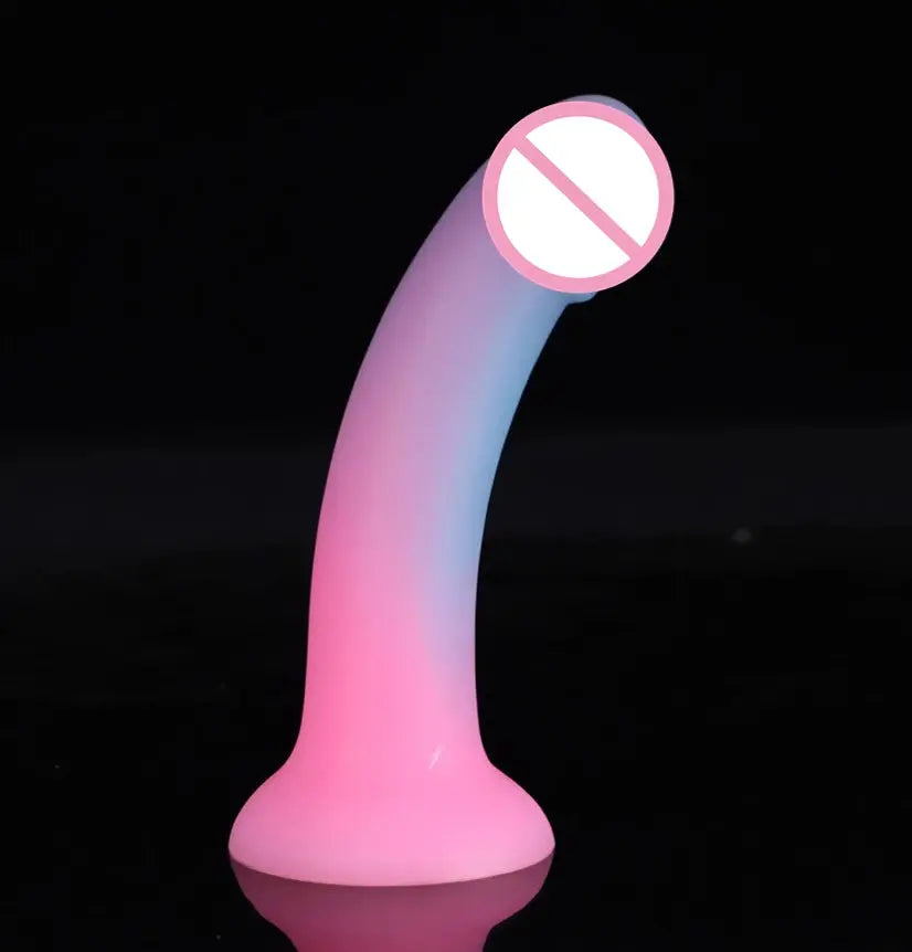 Soft luminous silicone dildo with realistic skin feel, suction cup base, designed for female masturbation and pleasure.