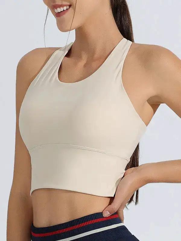 Shopezra L.L.C. women's shockproof sports underwear and one-piece yoga suit with fixed bra vest in milky white, ideal for running and fitness.