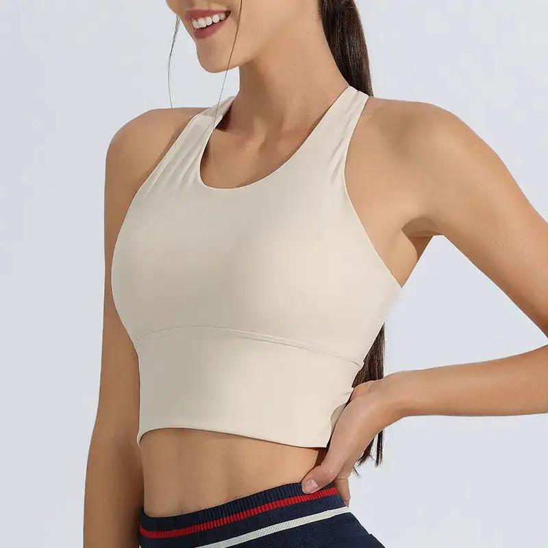 Milky white women's sports underwear set by SHOPEZRA L.L.C. includes shockproof, high-strength running and yoga suit with fixed bra vest.