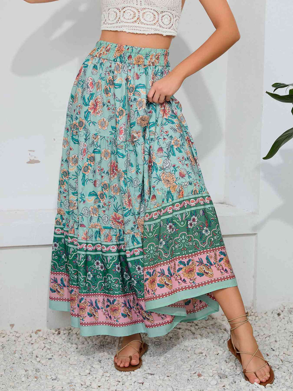 Marty Boho Maxi Skirt showcasing vibrant floral patterns, ideal for beach strolls, featuring a smocked waistband. bohemian print maxi skirt.