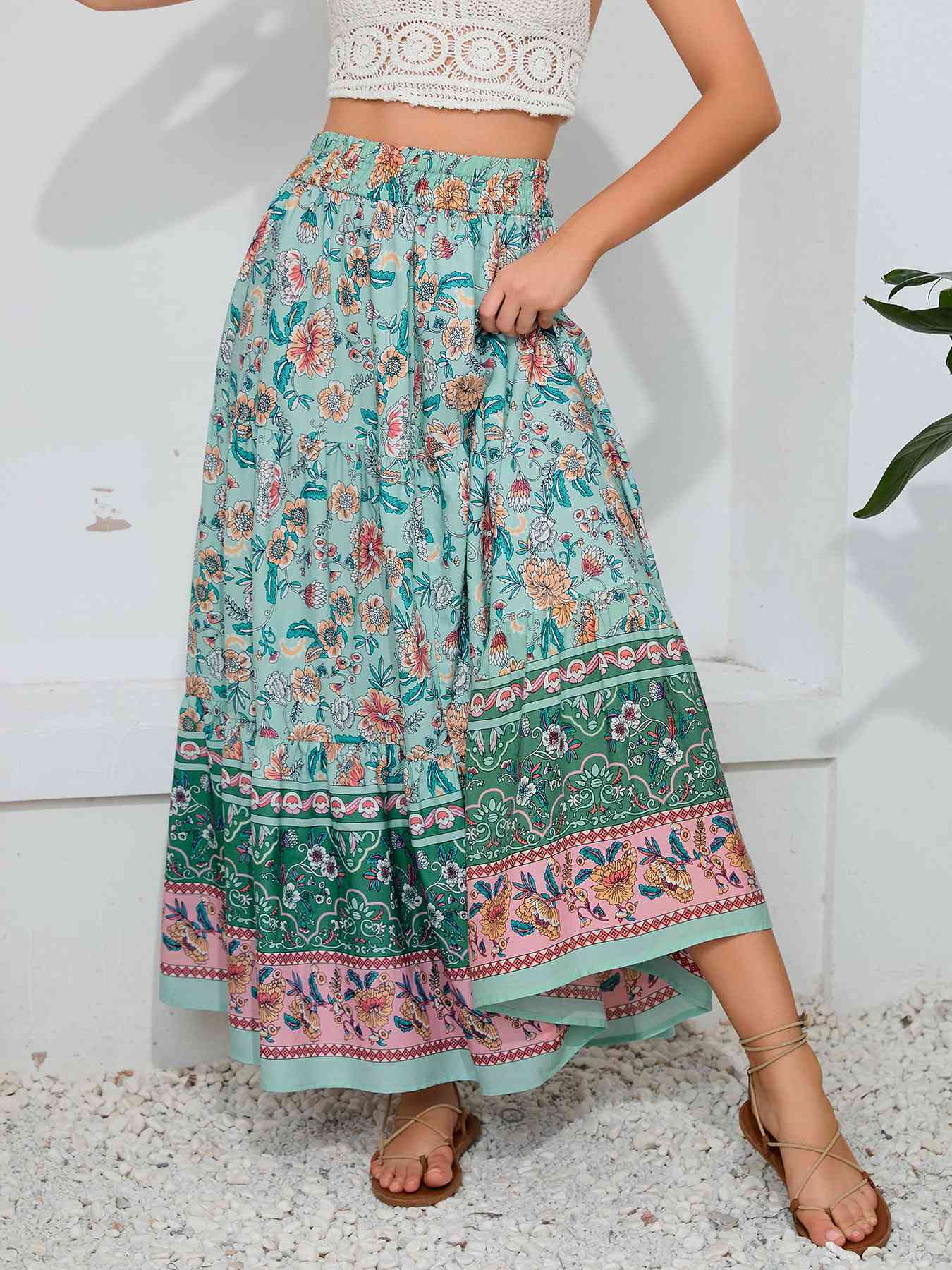 Marty Boho Maxi Skirt showcasing vibrant floral patterns, ideal for beach strolls, featuring a smocked waistband. bohemian print maxi skirt.