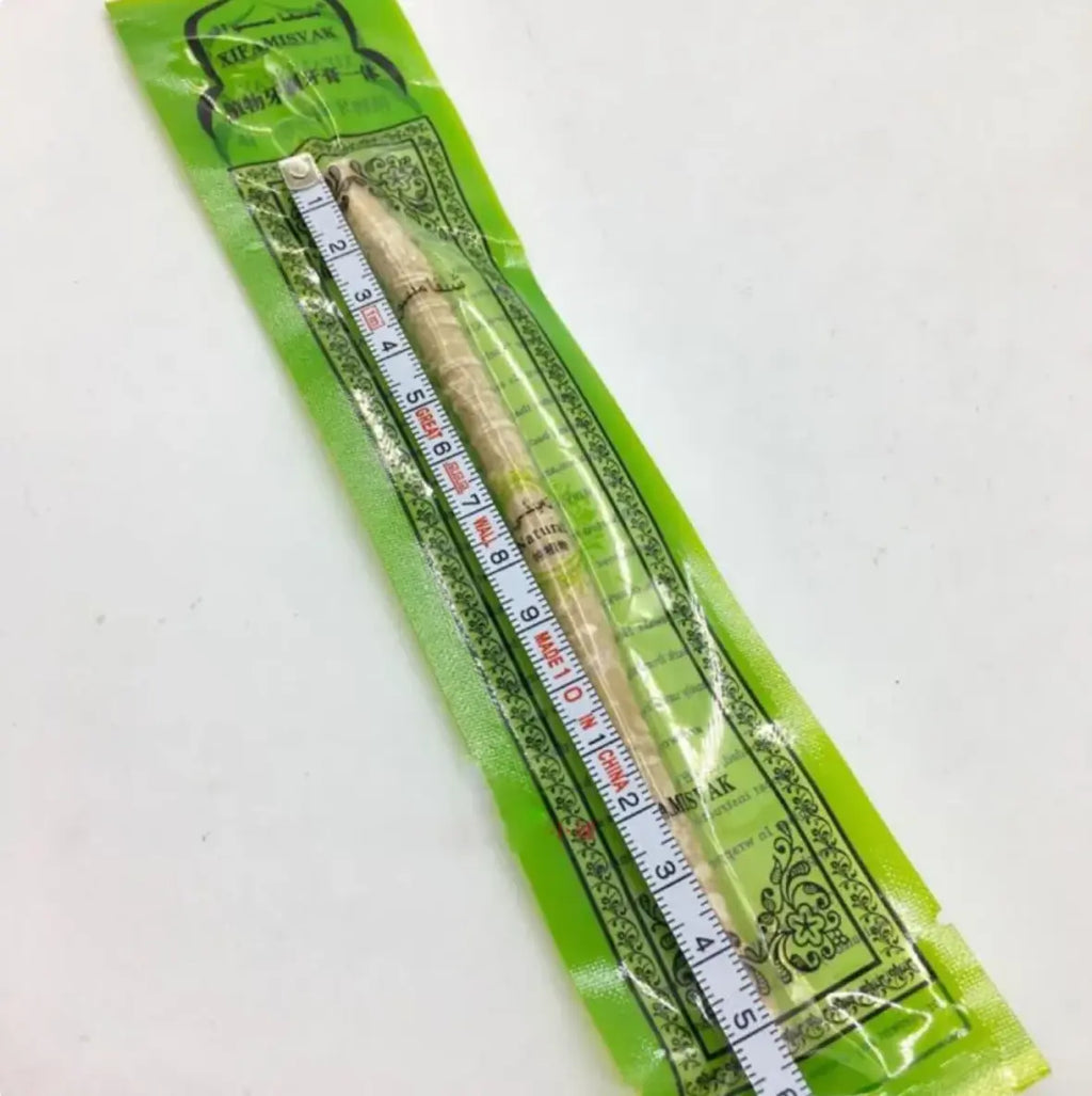 Natural miswak tooth cleaning stick packaged with a measuring scale for oral care and teeth cleaning.