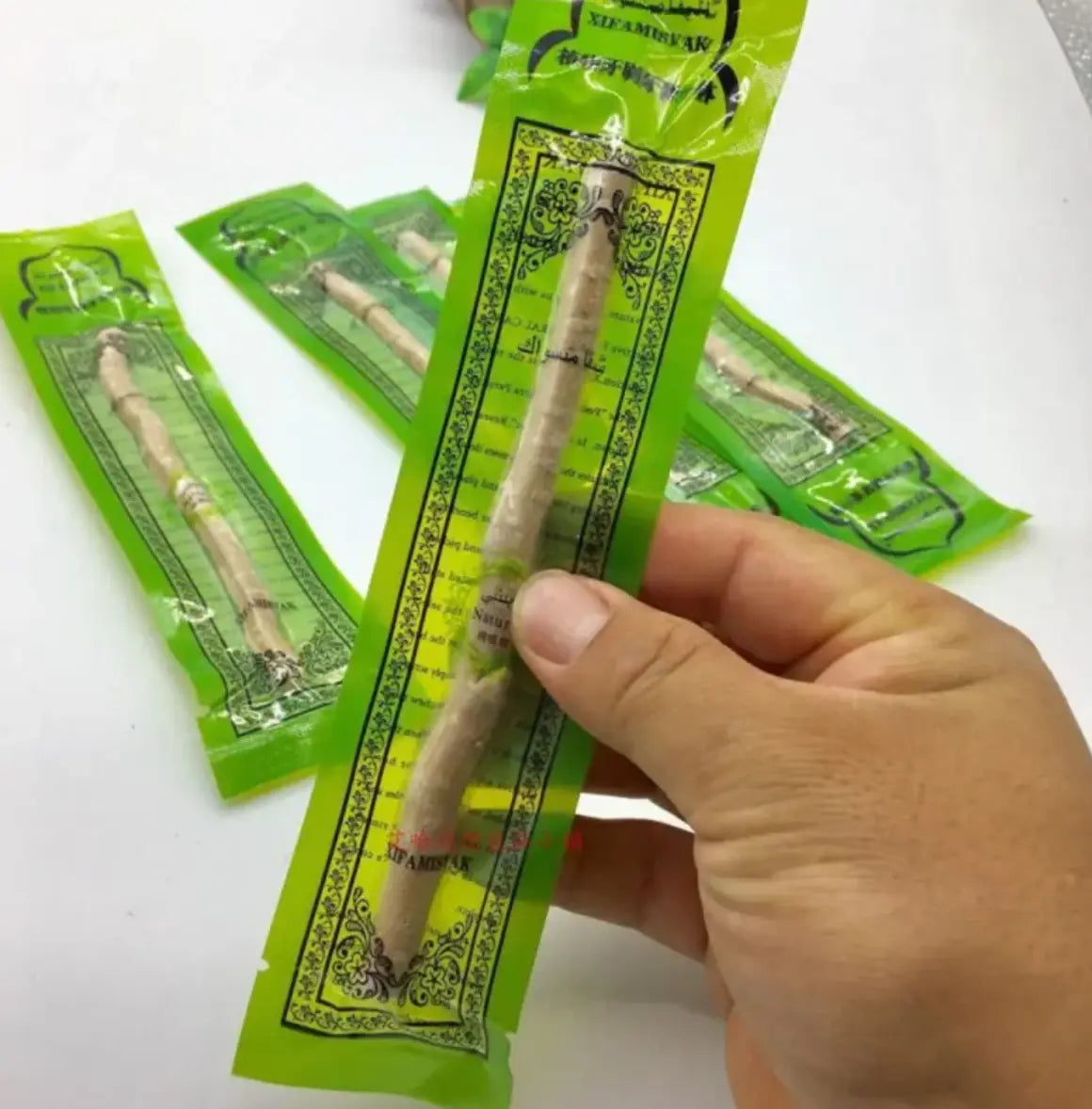 Natural Miswak tooth cleaning stick from SHOPEZRA L.L.C., showing the wooden stick used for traditional oral hygiene.
