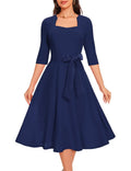 Plus size modest cocktail dress in navy with a sweetheart neckline and decorative belt, perfect for weddings or church.