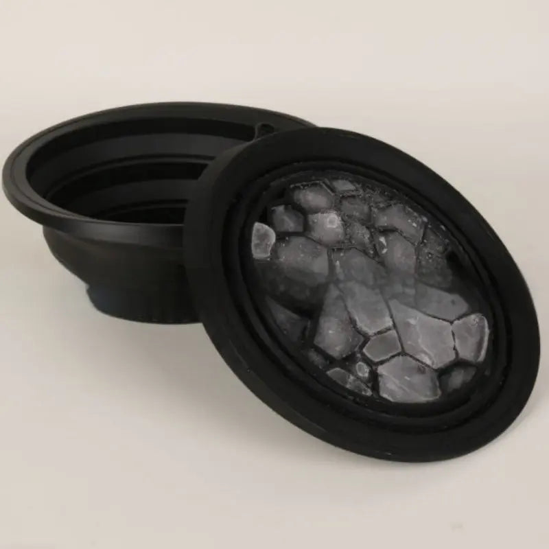 Collapsible silicone ice basin for spa treatments with ice cubes for refreshing facials.