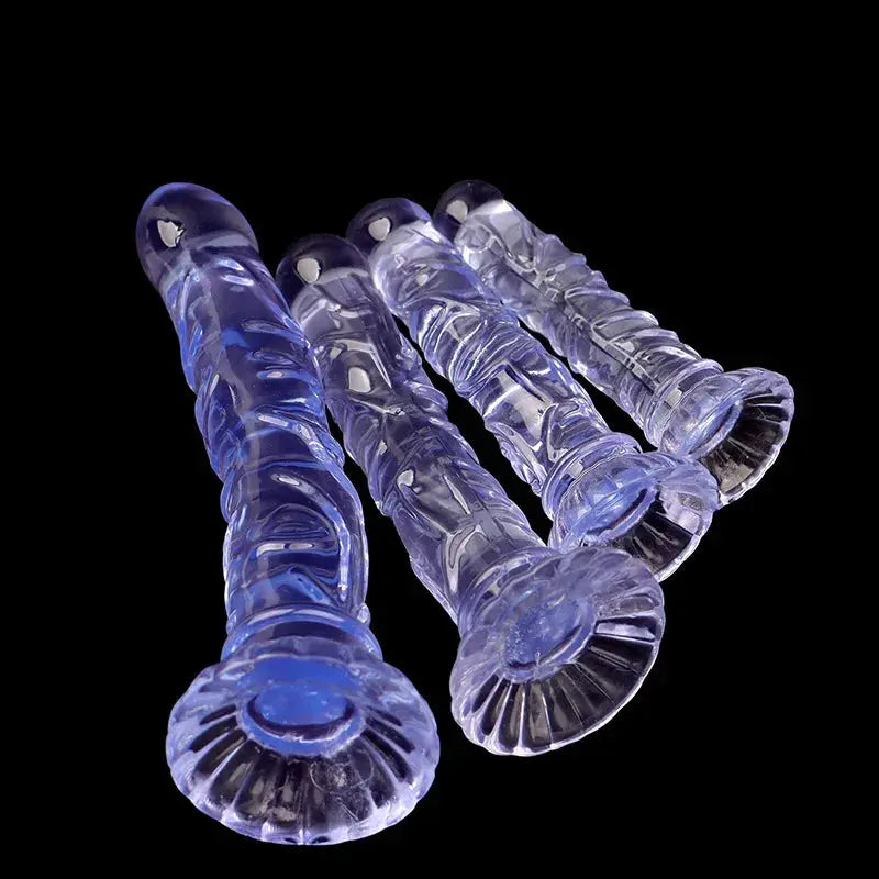 Pink textured anal plug with suction cup, designed for adult male and female pleasure, featuring realistic dildo detail.