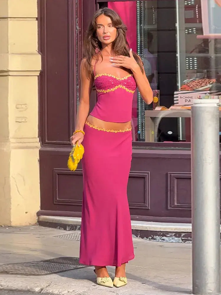 Pink 2-piece skirt set by Shopezra L.L.C. with sequin trim, halter crop top, and maxi skirt for spring and summer night outs.