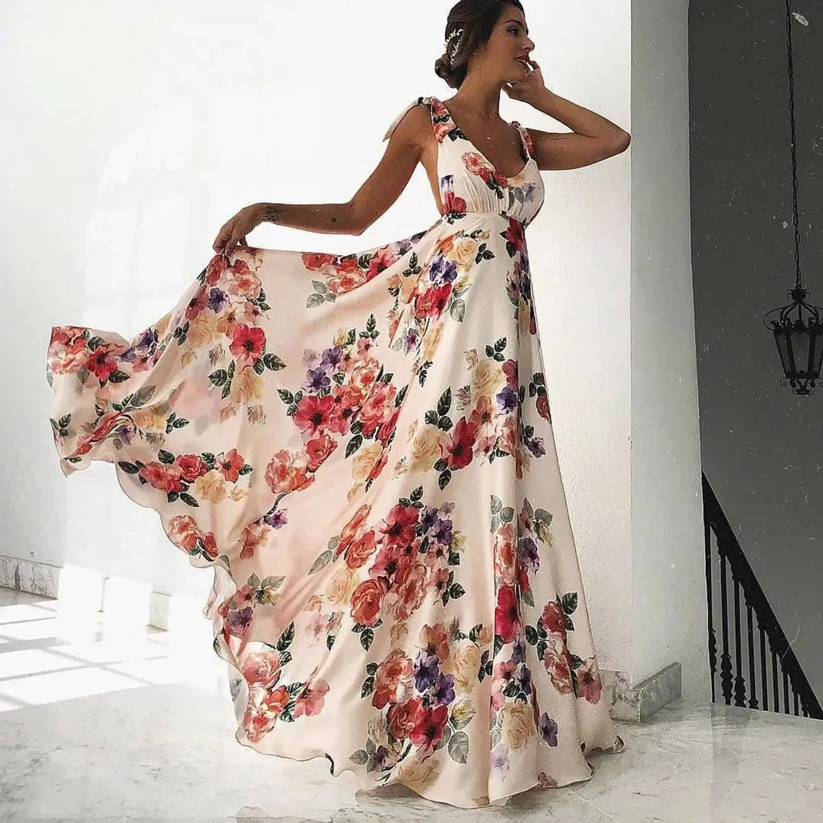 Pink boho-style long beach holiday maxi dress with halter neckline and colorful print, perfect for summer women’s vacation wear.