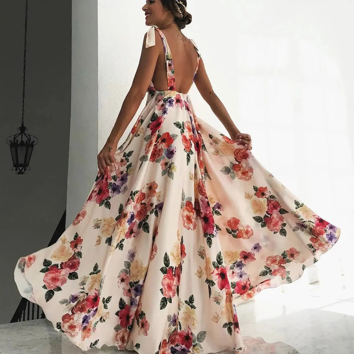 Pink boho style long maxi dress with halter neckline, floral print, perfect for beach holidays and summer wear for women.