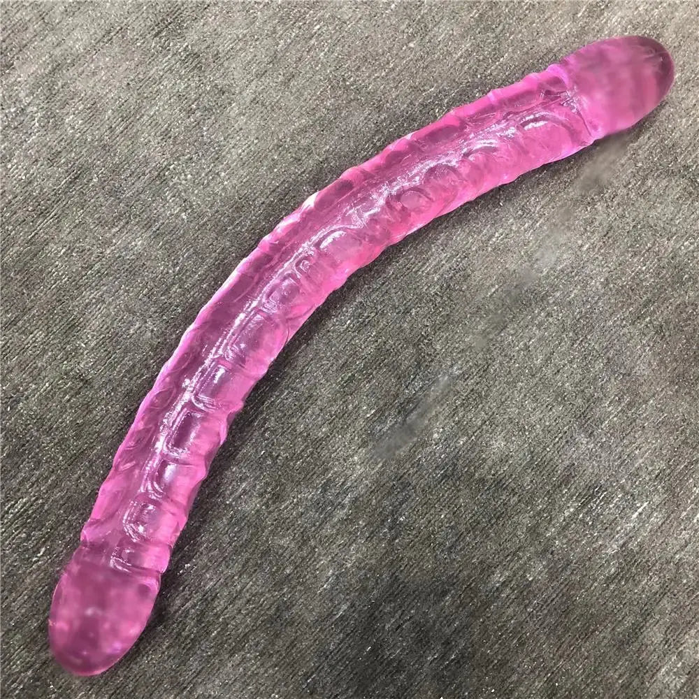 Purple double dildo and bullet vibrator with realistic penis design, suitable for lesbian couples and adult anal and vaginal pleasure.