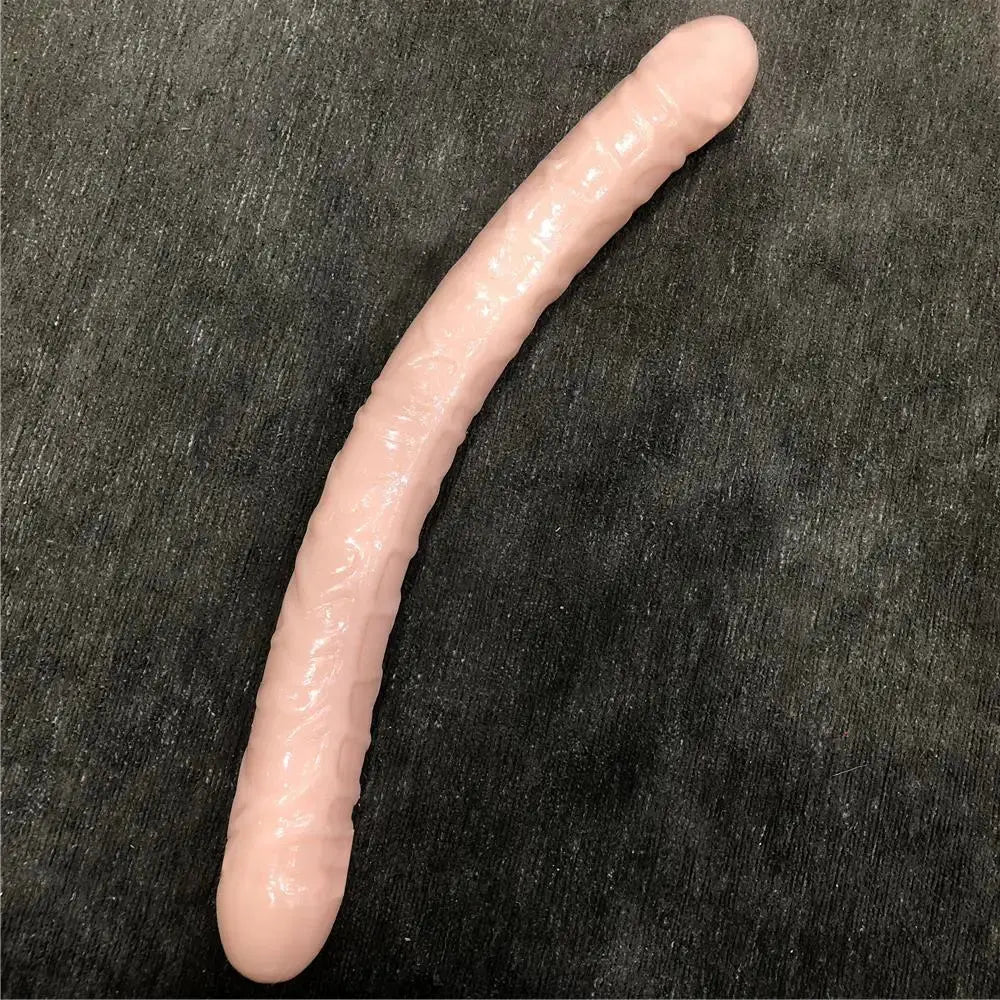 Purple double dildo with realistic penis design, ideal for lesbian couples, includes bullet vibrator for adult intimacy and pleasure.