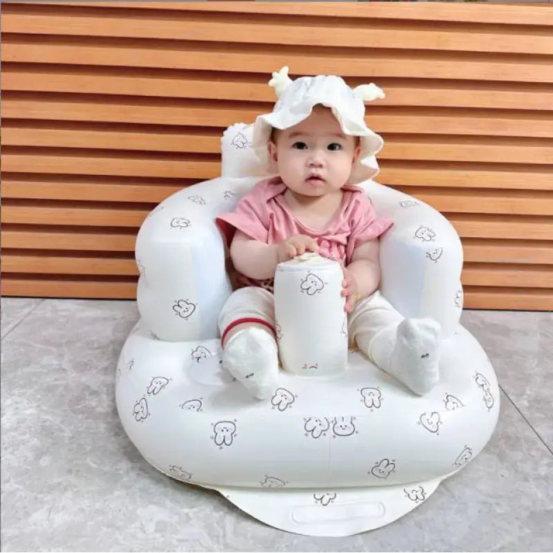 Inflatable baby chair in rainbow colors by SHOPEZRA L.L.C., designed for dining and bath use, with a soft, cushioned seat.