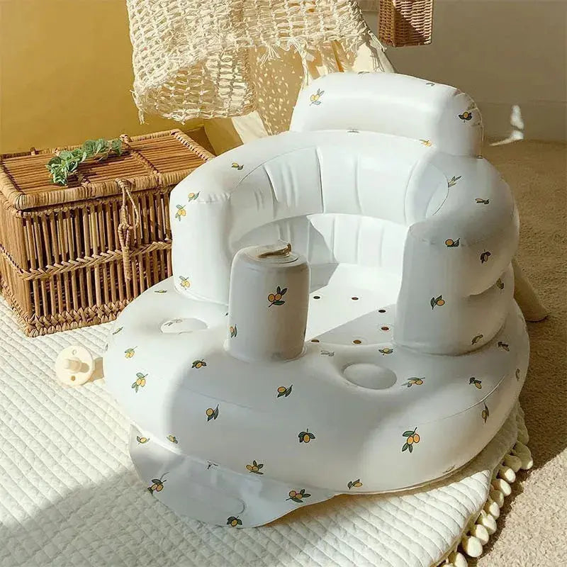 Inflatable baby chair by SHOPEZRA L.L.C. in rainbow colors, designed for dining and bath use with soft, safe material.
