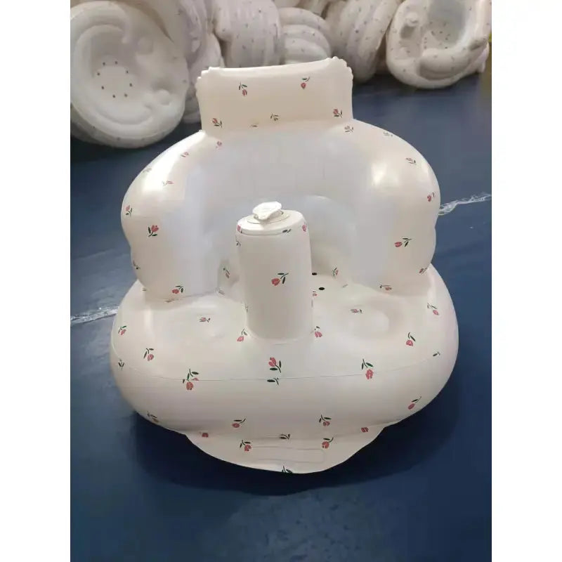 Inflatable baby chair for dining and bath by SHOPEZRA L.L.C., featuring rainbow colors and soft, secure design for infants.