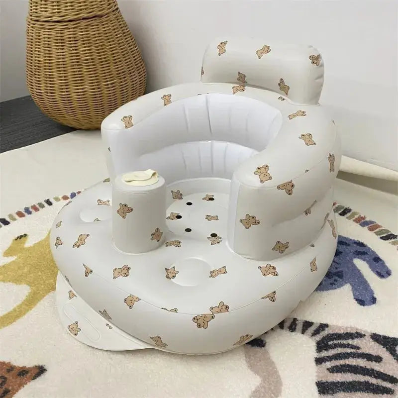 Inflatable baby chair by SHOPEZRA L.L.C. in rainbow colors, designed for dining and bath use with soft, supportive seating.