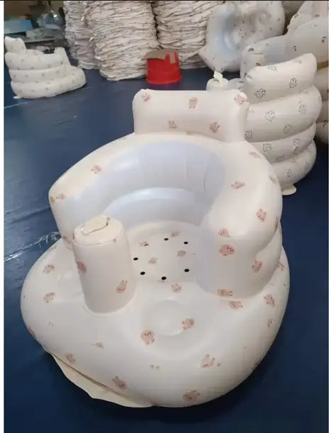 Inflatable baby chair in rainbow colors by SHOPEZRA L.L.C. designed for dining and bath use, shown inflated and ready for use.