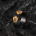 vintage adjustable ring for women featuring intricate gold design on dark textured band against a rocky background.