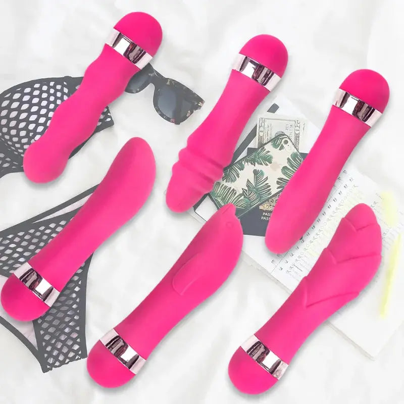Pink G-spot and vaginal vibrator by SHOPEZRA L.L.C. with anal plug, designed for female pleasure and stimulation.