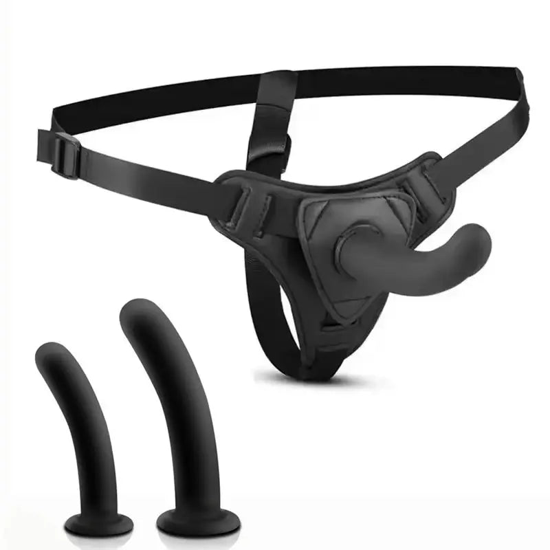 Realistic wearable dildo sex toy with strap-on, suction cup base, and anal plug, designed for lesbian women and couples.