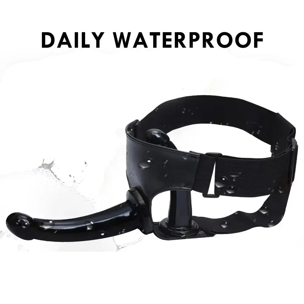 Realistic black dildo with suction cup and harness strap for women, featuring a large, detailed penis design and ultra-elastic strap.