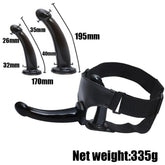 Black realistic dildo with suction cup, jelly material, and strap-on harness for women, featuring a large, detailed penis design.