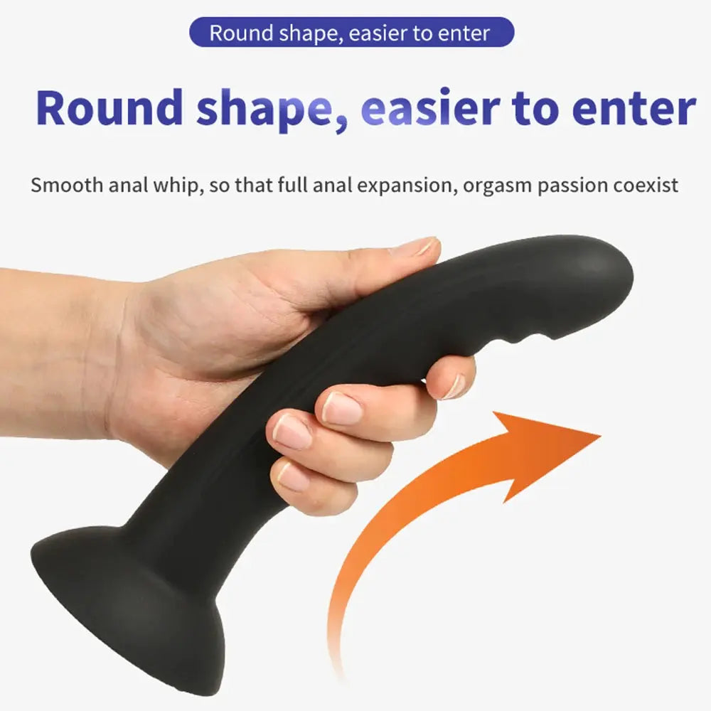 Silicone dildo with large penis shape, suction cup base, used as a prostate massager and adult sex toy for women.