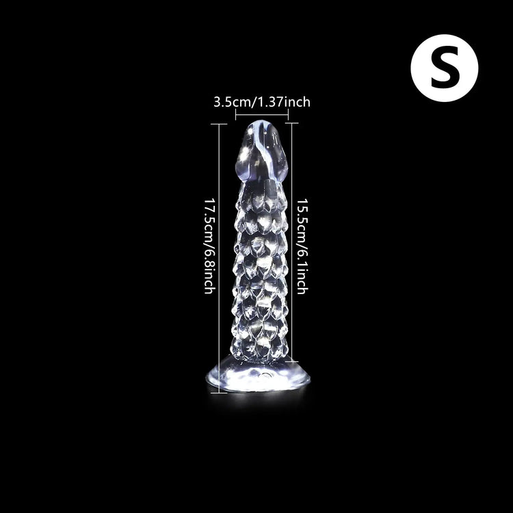Transparent Dragon Scale Dildo with suction cup, anal and vaginal plug, designed for female pleasure and masturbation.