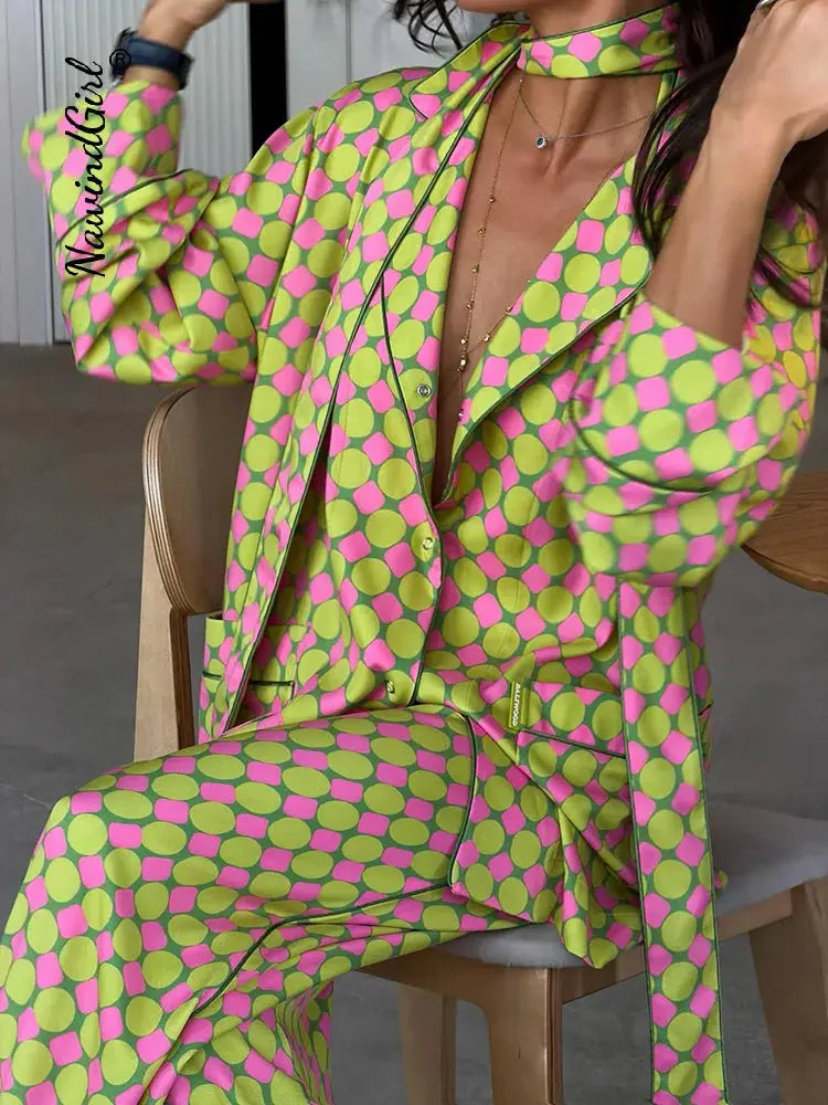 Casual plaid women's blazer and wide-leg trousers set with long sleeves, button shirt, and scarf collar, summer 2026 style.