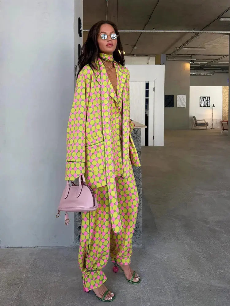 Casual plaid women's blazer and wide-leg trousers set with scarf collar, long sleeves, button shirt, and pleated pants.