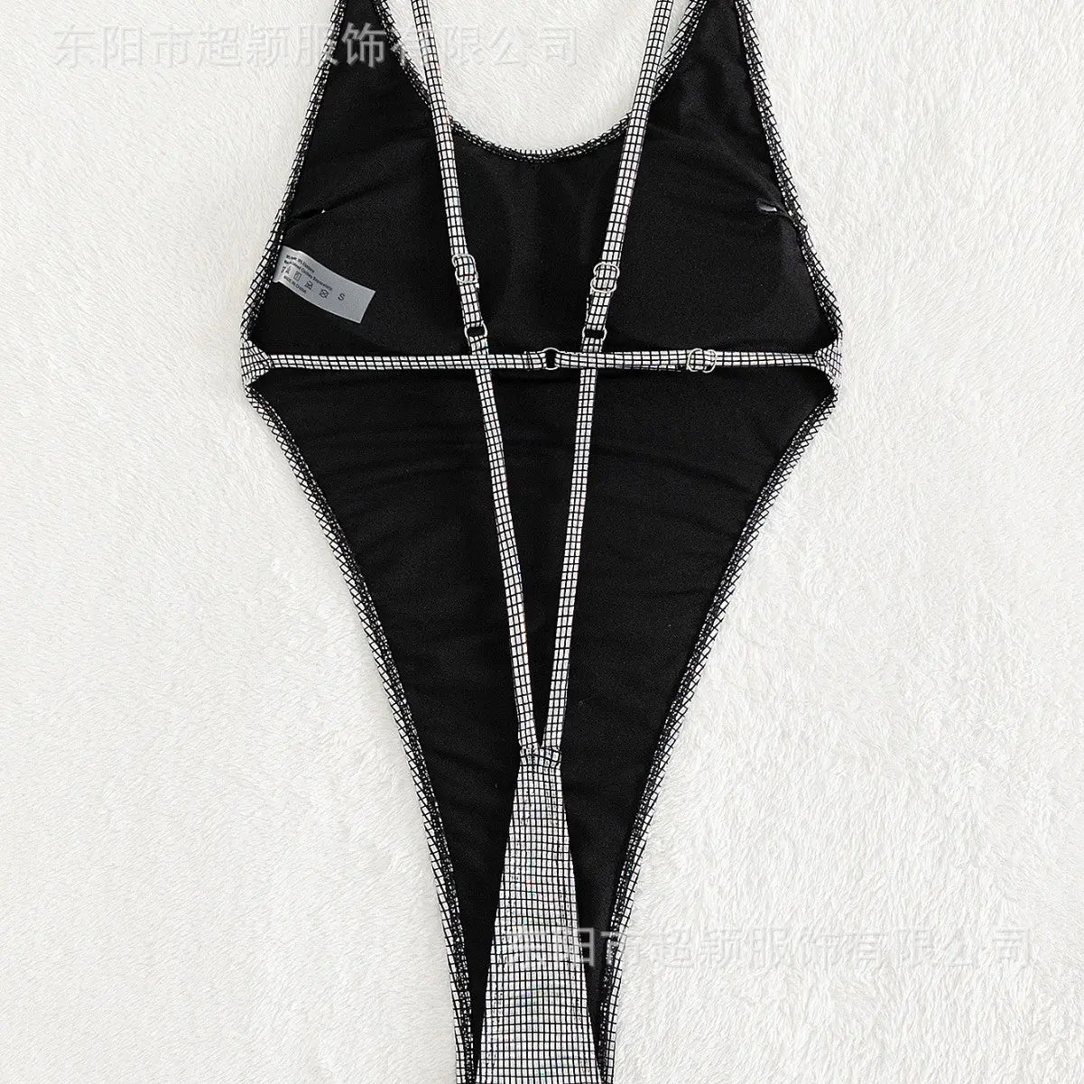 Silver backless thong one-piece swimsuit by SHOPEZRA L.L.C., featuring a bright surface, sexy European and American style.