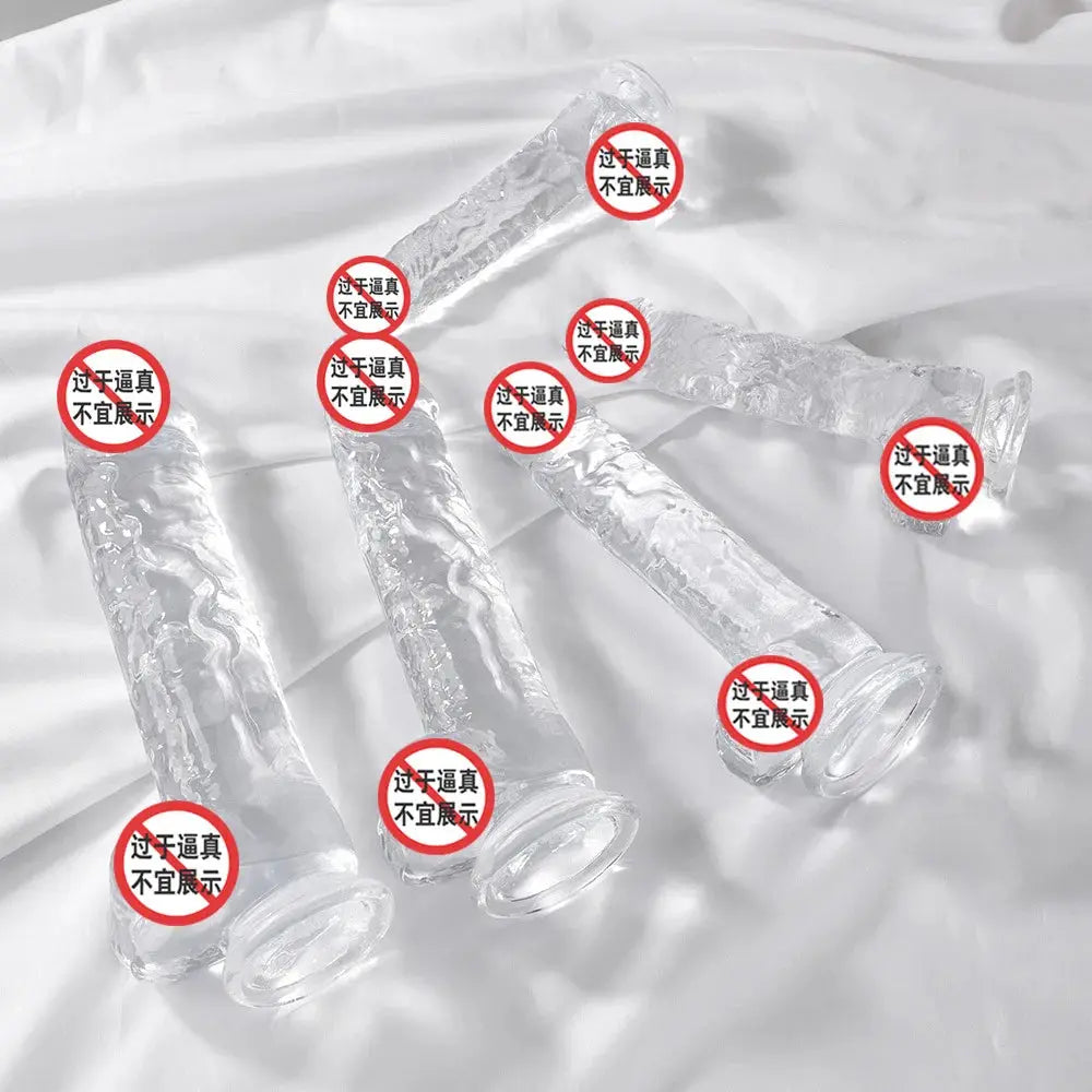 Mini clear silicone dildo from SHOPEZRA L.L.C., showing a small, smooth, transparent adult toy on a white background.