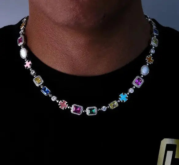 Gold-plated hip hop gemstone necklace featuring vibrant colored zircon stones worn on a black shirt.