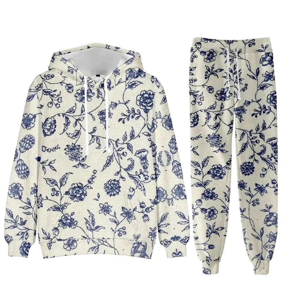 Elegant floral women's tracksuit set with hoodie and jogger pants, featuring a chic and oversized design for sports or lounge wear.