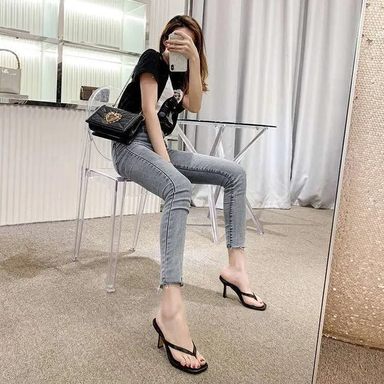 White women's fashion sandals by SHOPEZRA with thin straps, thong toe design, open-toe style, thin high heels, size 34-43.