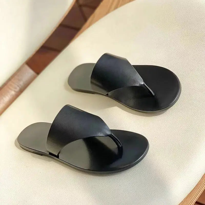White SHOPEZRA L.L.C. women's flat thong sandals for outdoor wear, summer fashion Roman beach slippers with slip-on design.